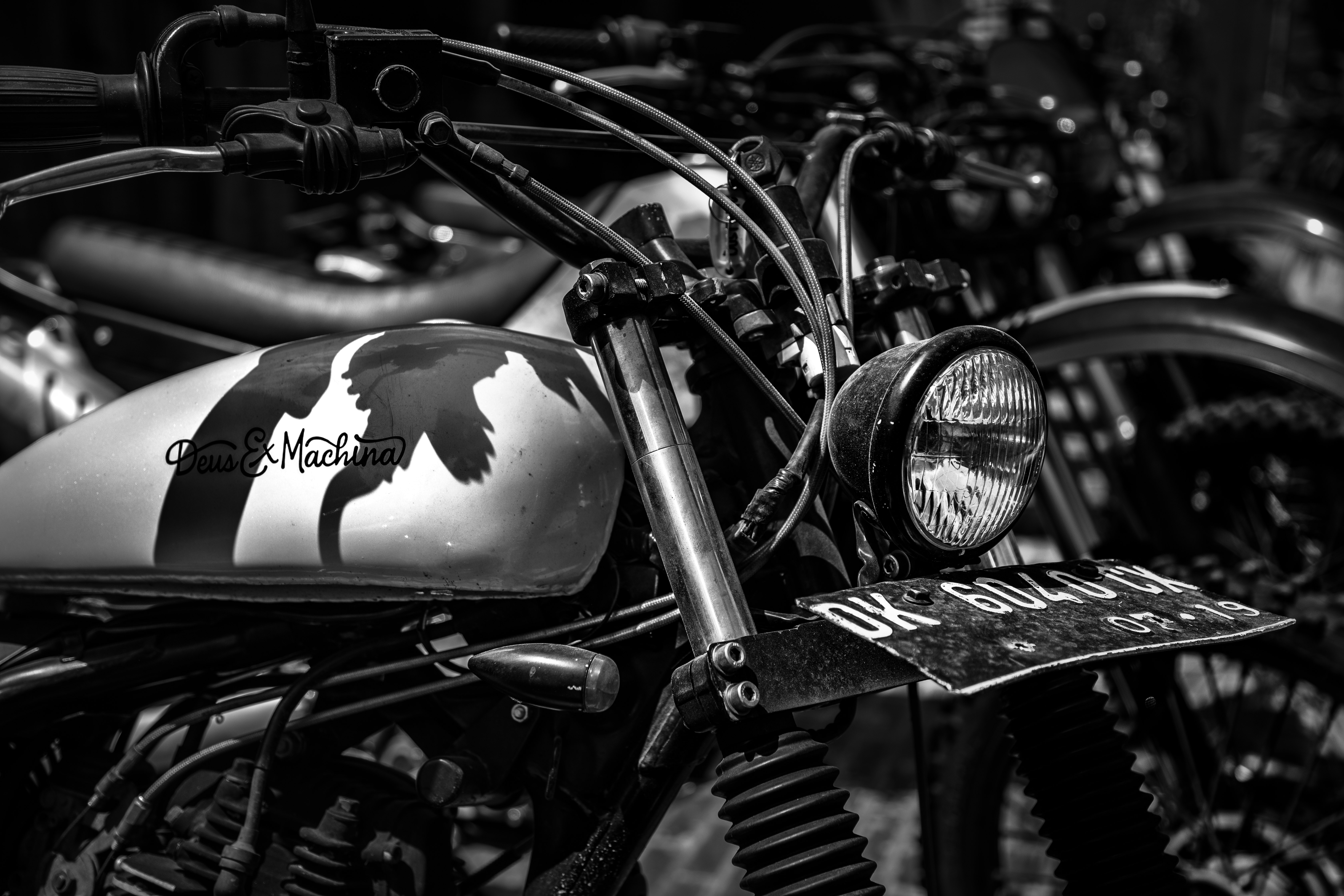 grayscale photo of park standard motorcycles